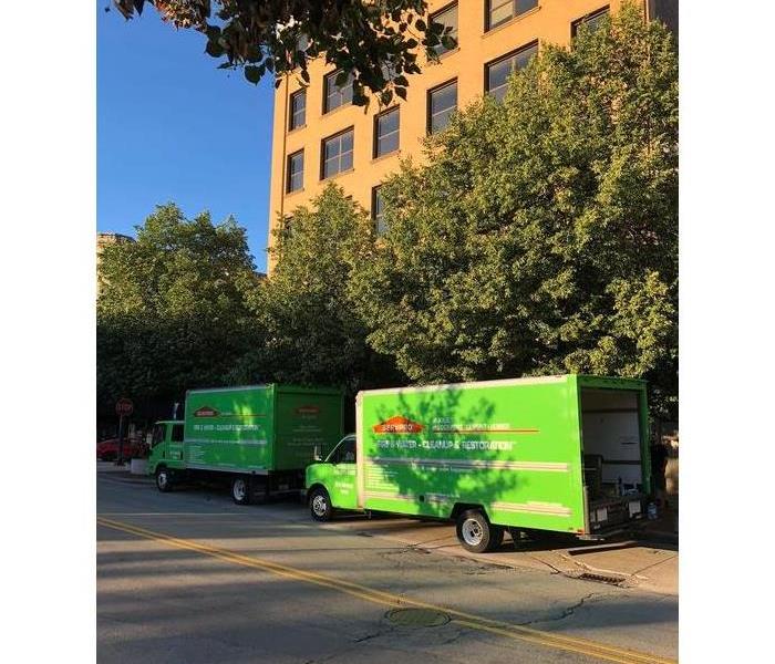 SERVPRO Trucks in front of commercial building